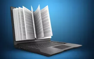 Livro aberto saindo da tela de um notebook